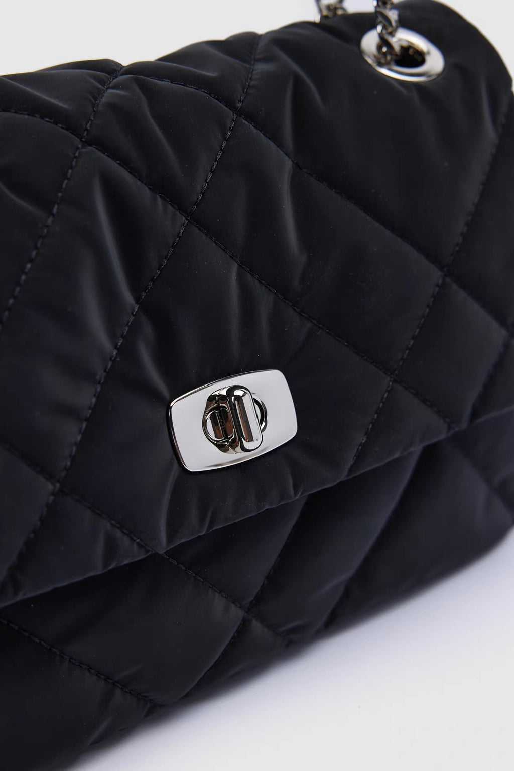 Sylvie Quilted Silver Chain Bag — closure and hardware detail