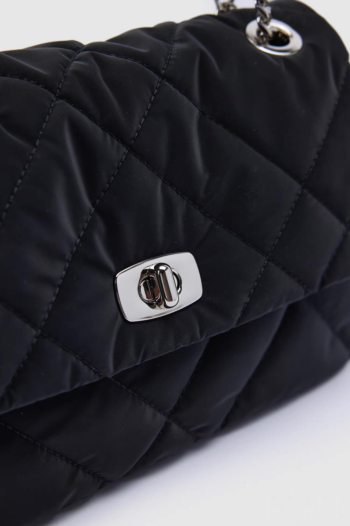 Sylvie Quilted Silver Chain Bag — closure and hardware detail