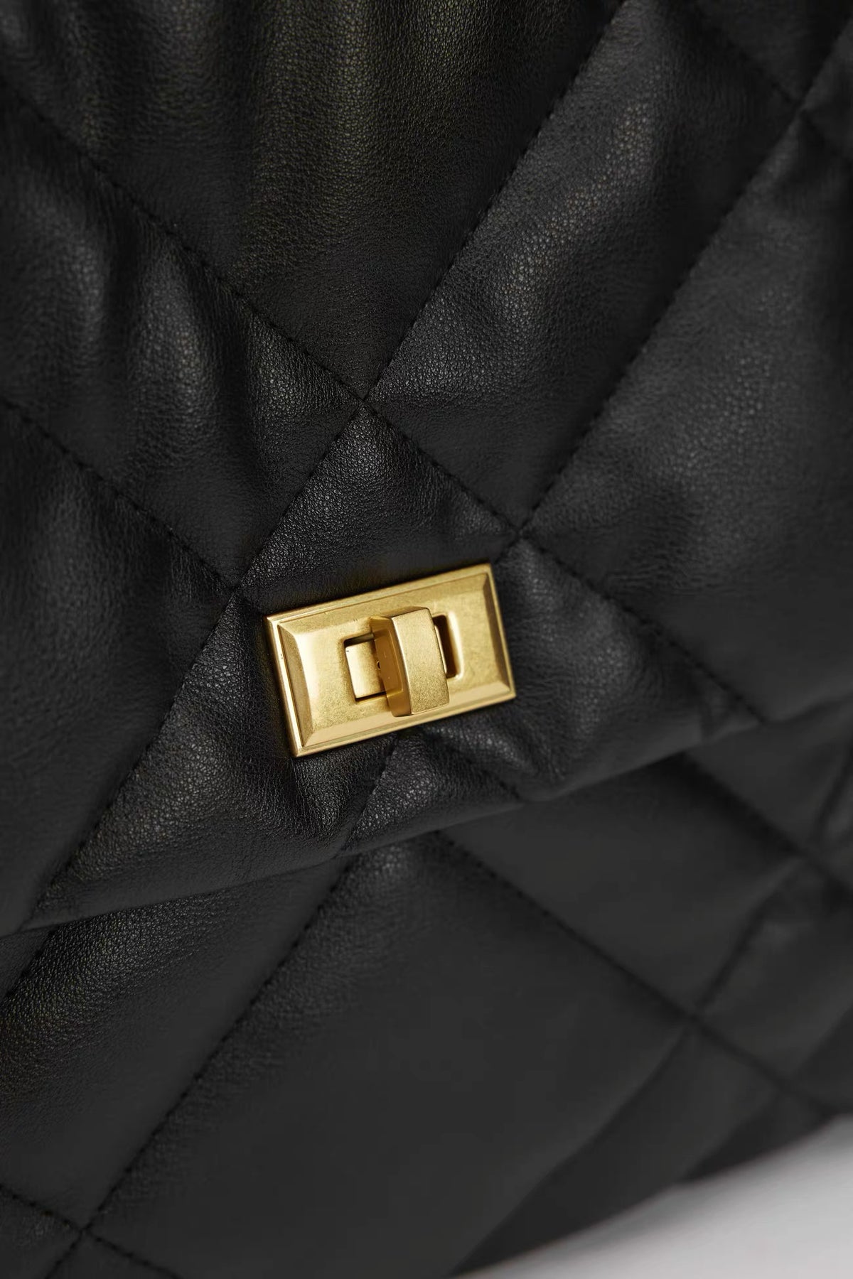 Agathe Quilted Shoulder Bag — closure and hardware detail