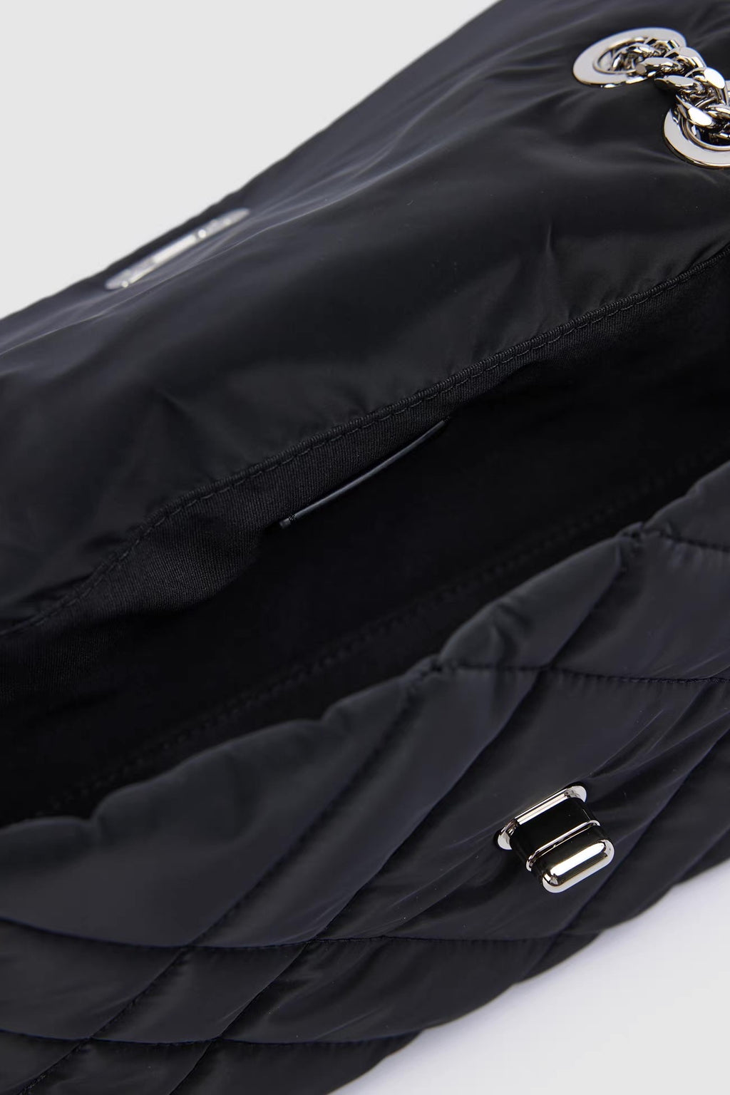 Sylvie Quilted Silver Chain Bag — shown on a model