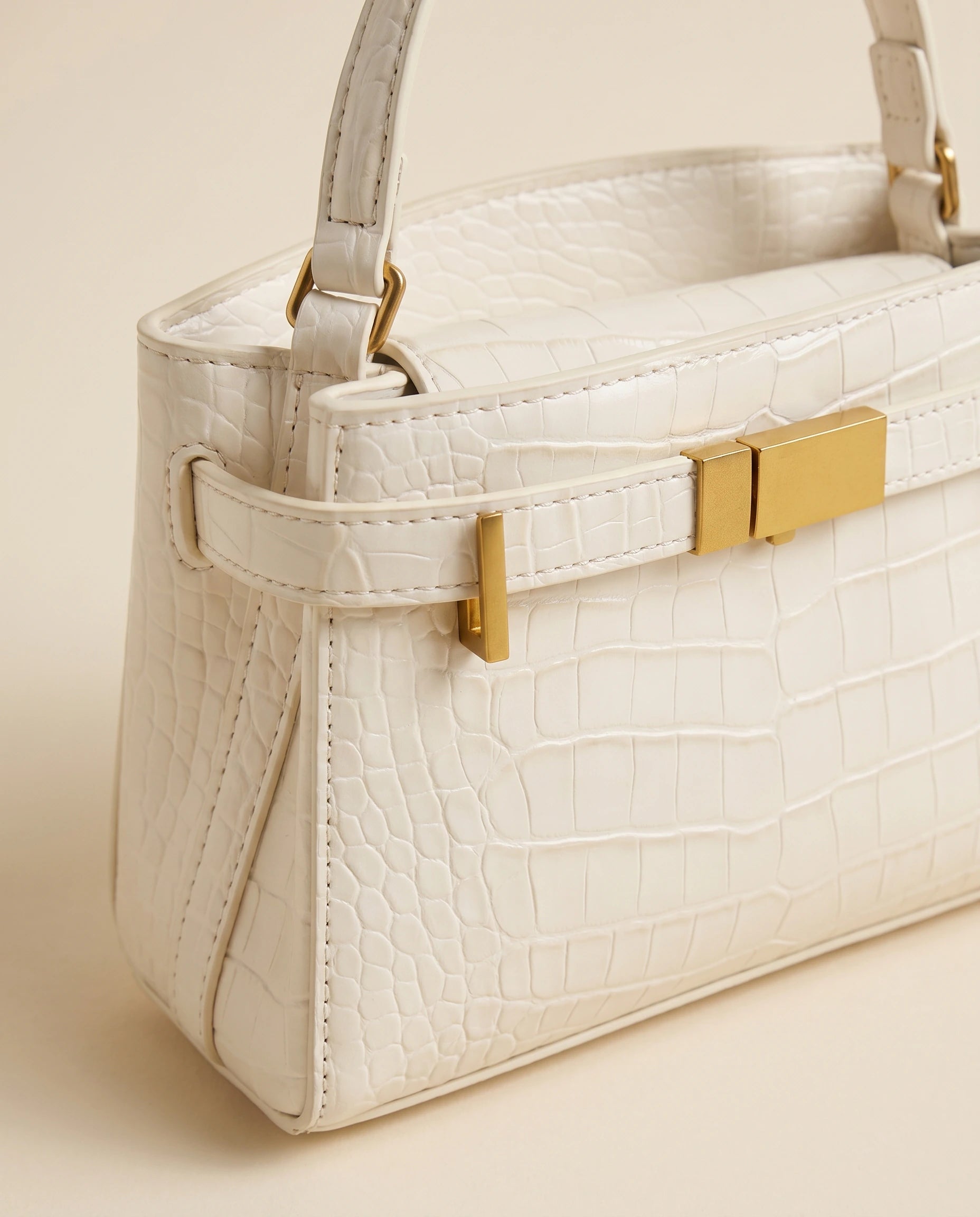 Crocodile Embossed Structured Handbag in White — detail close-up