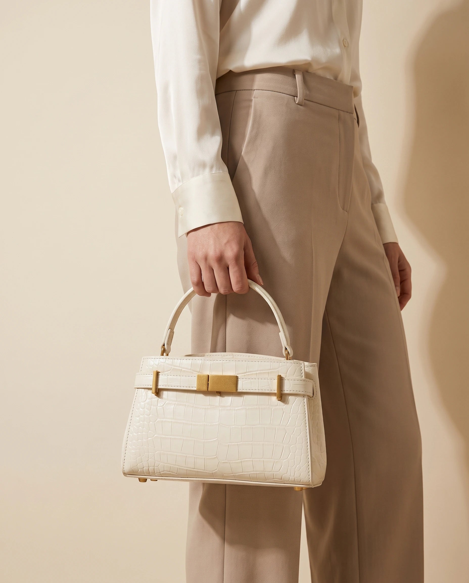 Crocodile Embossed Structured Handbag in White — worn by model