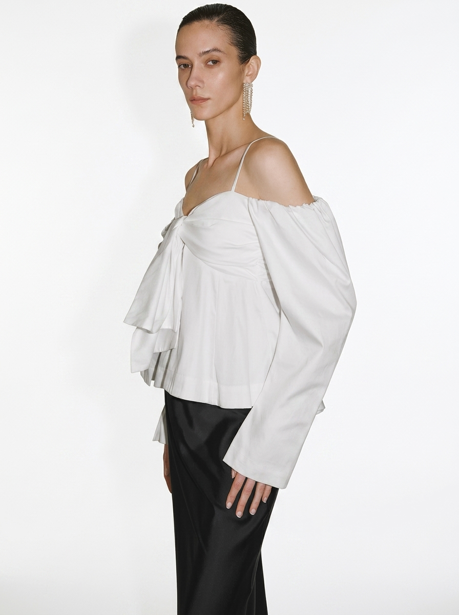white blouse with a large front bow