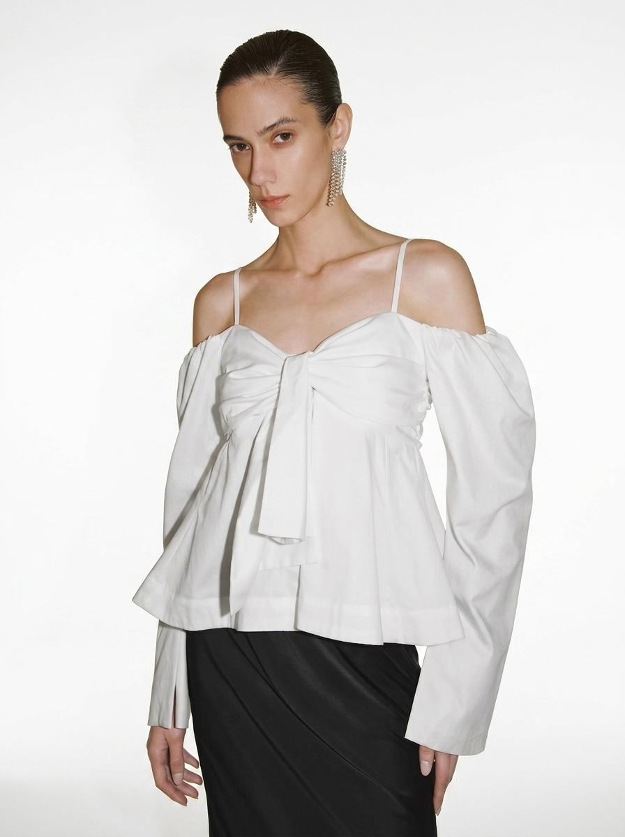 white blouse with a large front bow