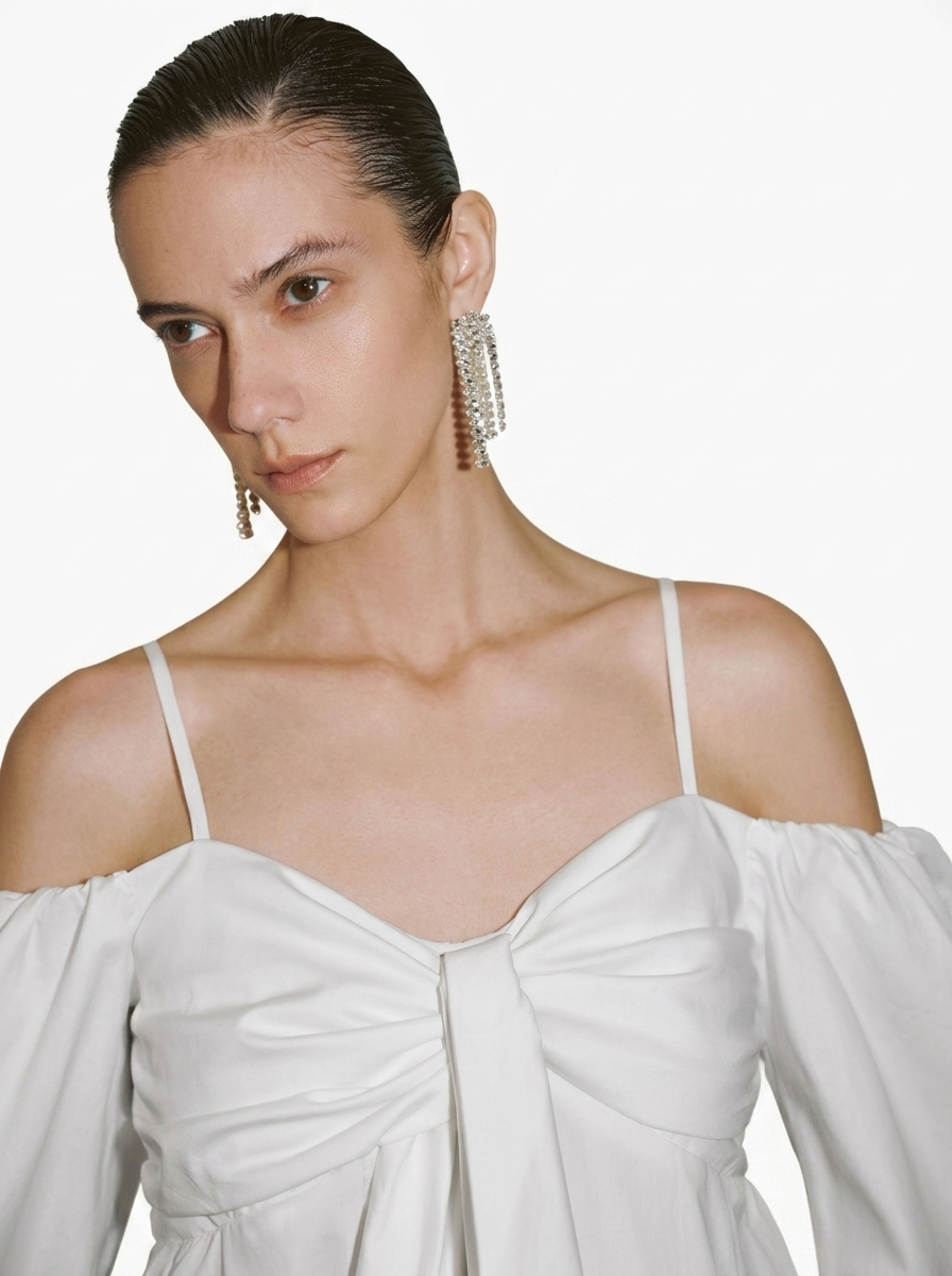 white blouse with a large front bow