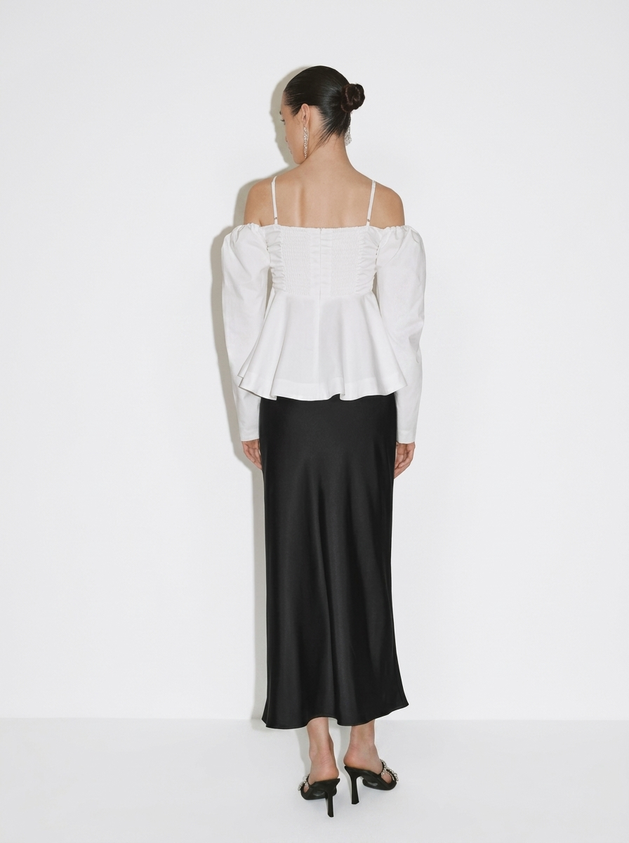white blouse with a large front bow