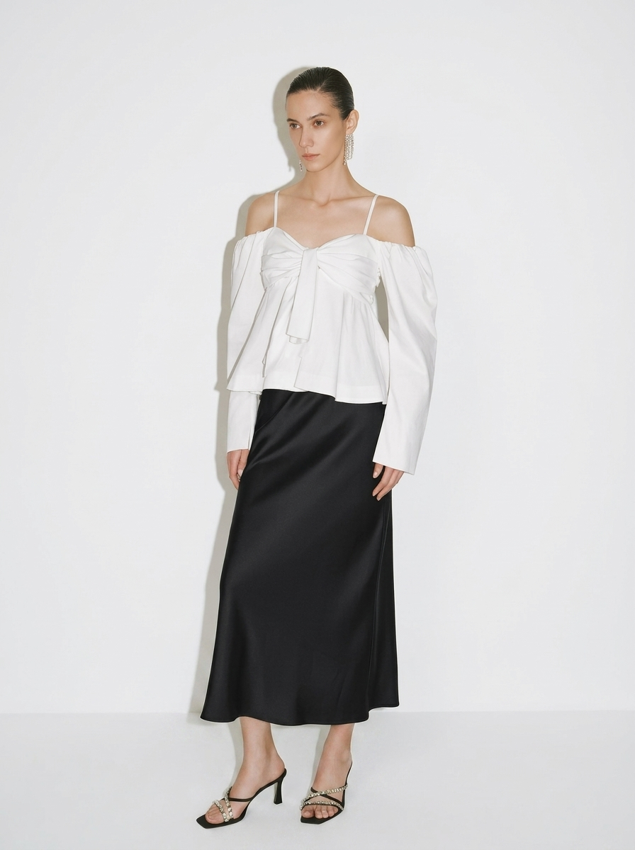 white blouse with a large front bow