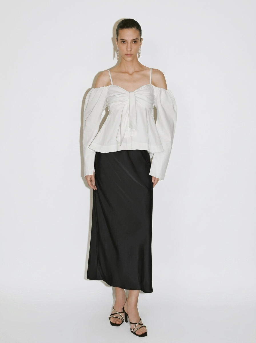 white blouse with a large front bow
