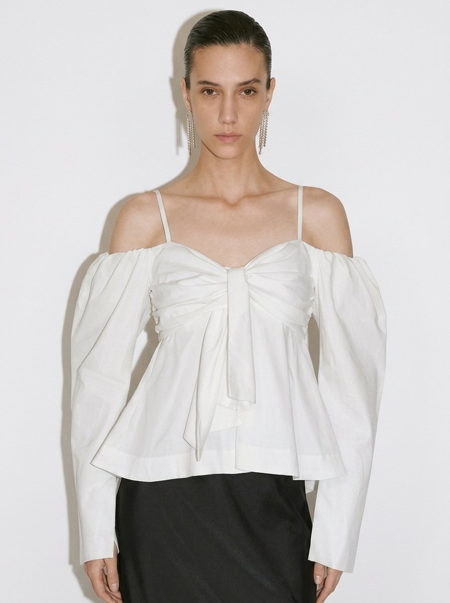 white blouse with a large front bow